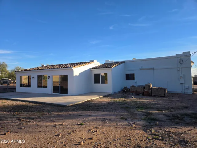 a house view with a backyard space