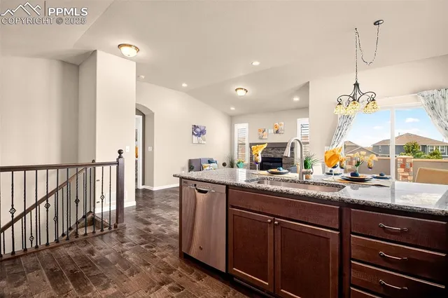 a kitchen with sink and cabinets