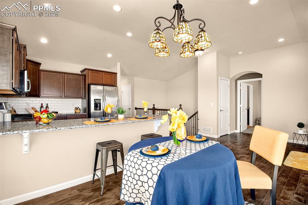 4293 Hessite Loop Colorado Springs, CO 80938 - Photo 16 of 37 a view of a dining room with furniture