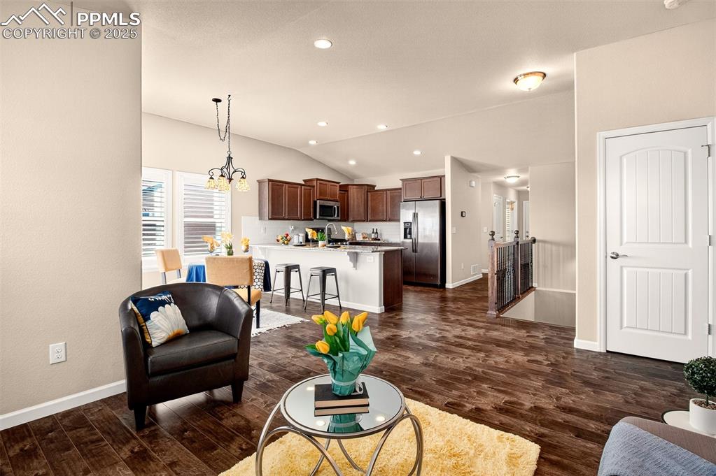 4293 Hessite Loop Colorado Springs, CO 80938 - Photo 19 of 37 a living room with furniture and a wooden floor