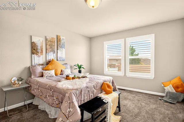 a bedroom with bed and a window