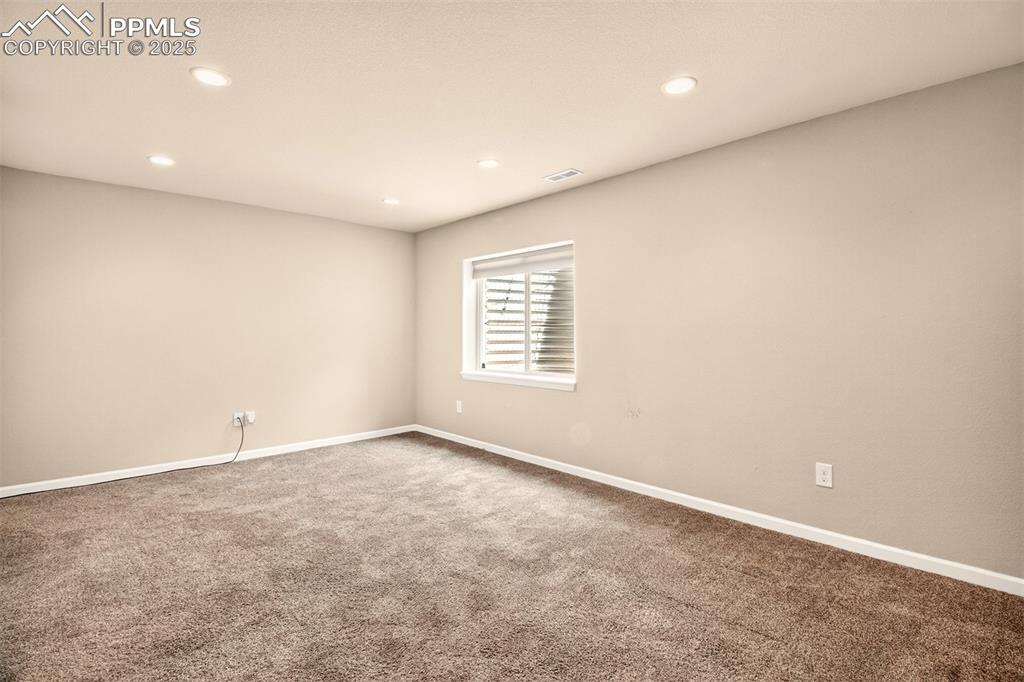 4293 Hessite Loop Colorado Springs, CO 80938 - Photo 25 of 37 an empty room with windows