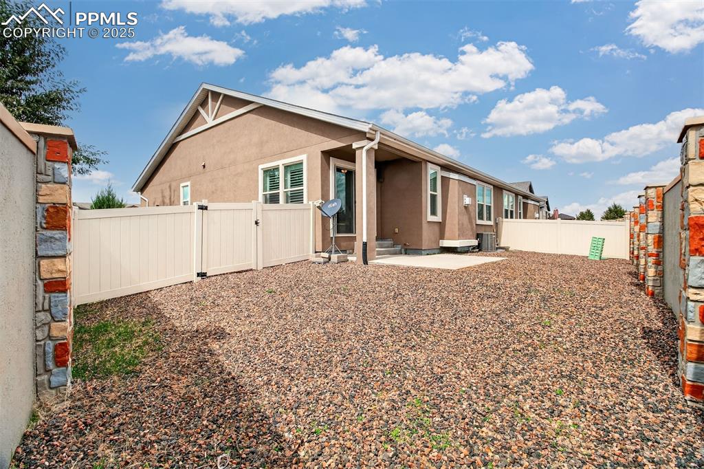 4293 Hessite Loop Colorado Springs, CO 80938 - Photo 35 of 37 a view of a house with a yard