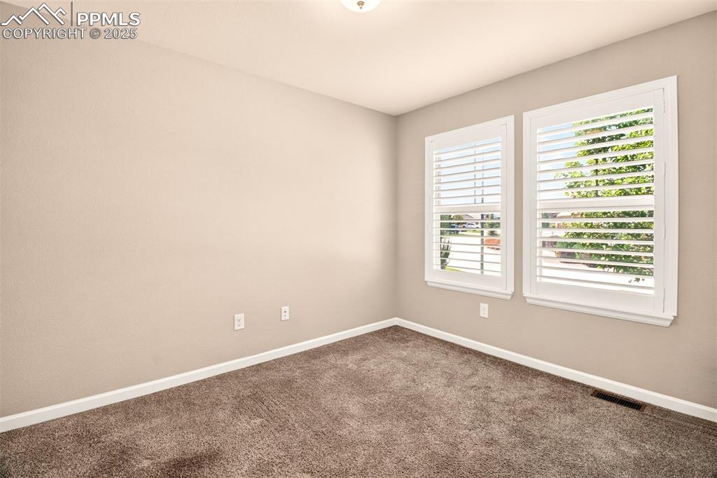 4293 Hessite Loop Colorado Springs, CO 80938 - Photo 8 of 37 an empty room with a window