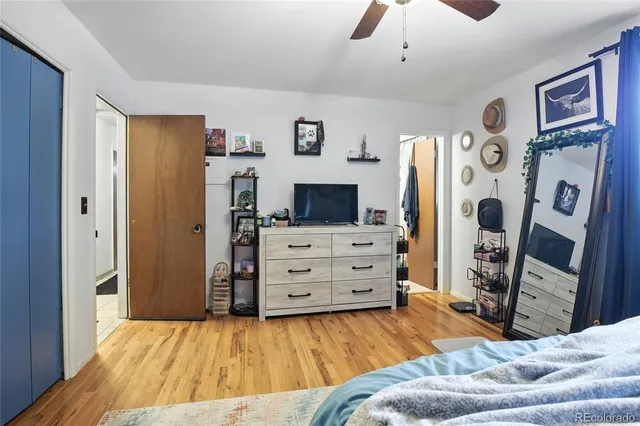 a bedroom with a bed and a television