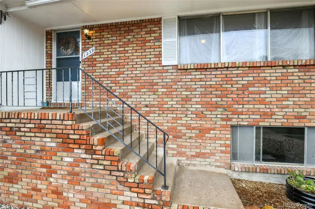 a view of a brick house with an empty space
