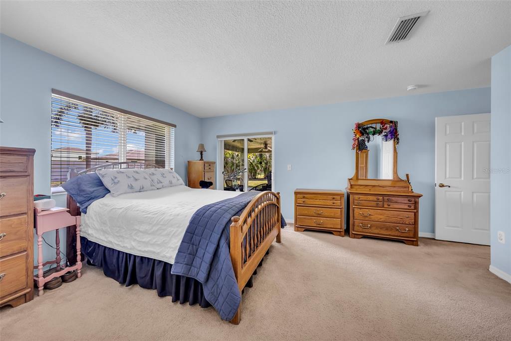 21131 Southwest 128th Court Miami, FL 33177 - Photo 14 of 24 a bed room with a bed and a window