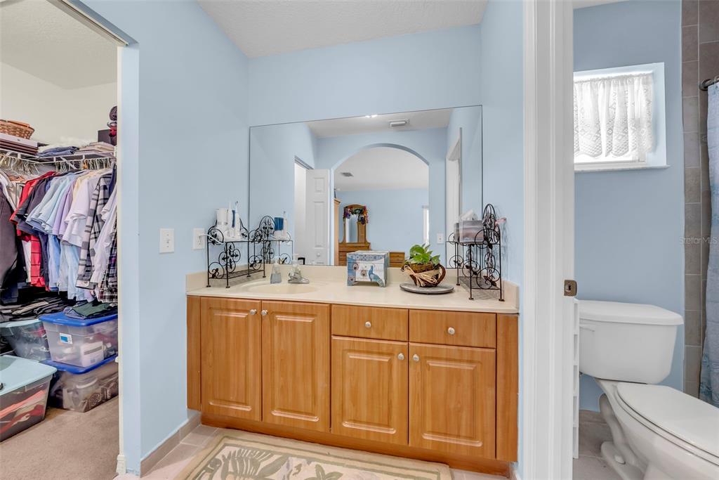 21131 Southwest 128th Court Miami, FL 33177 - Photo 15 of 24 a bathroom with a sink a toilet and a mirror