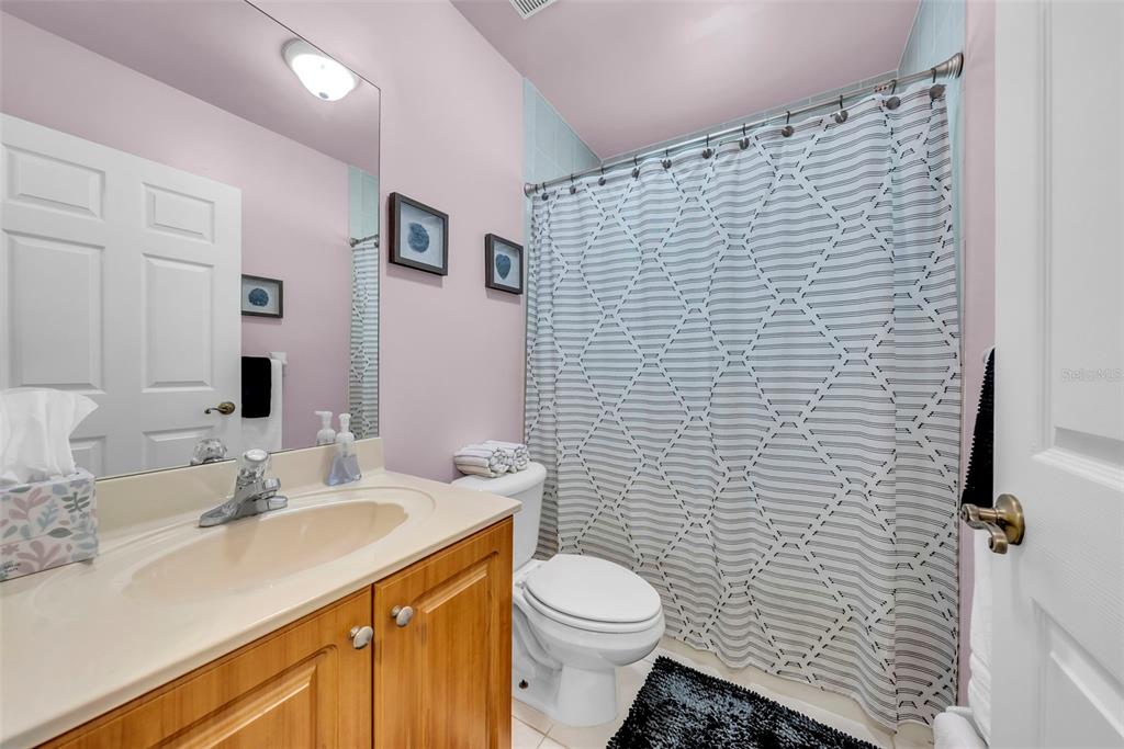 21131 Southwest 128th Court Miami, FL 33177 - Photo 18 of 24 a bathroom with a sink a toilet and shower
