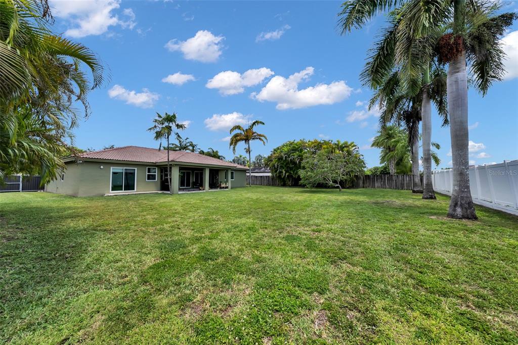 21131 Southwest 128th Court Miami, FL 33177 - Photo 23 of 24 a front view of a house with garden