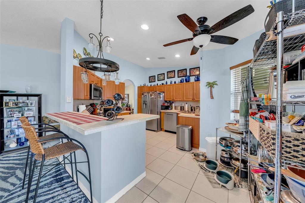 21131 Southwest 128th Court Miami, FL 33177 - Photo 10 of 24 a view of a dining room with furniture and a window