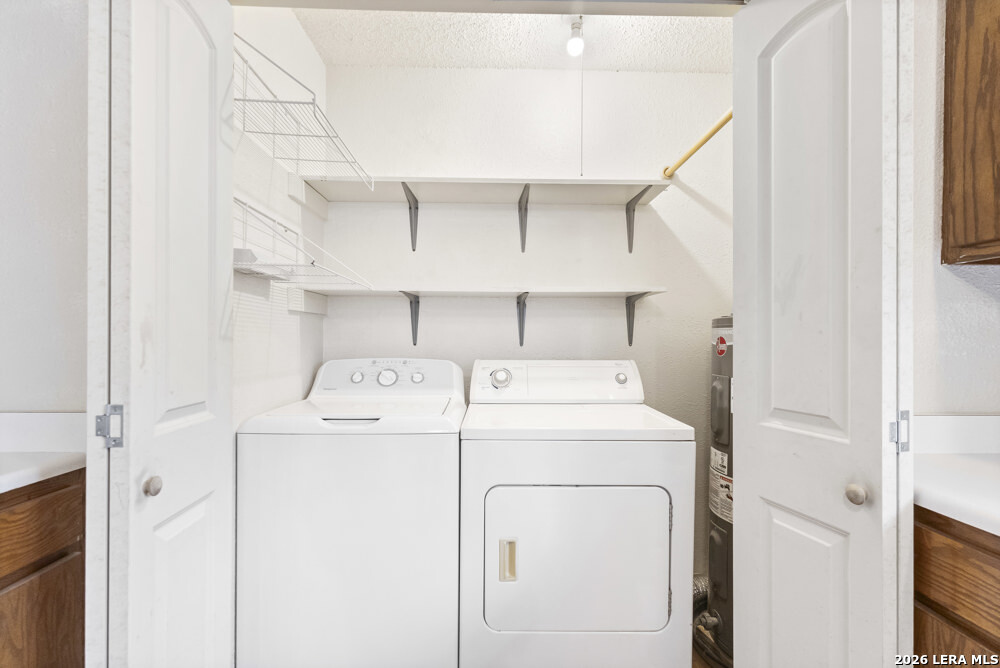 292 Montague Drive Bandera, TX 78003 - Photo 13 of 24 a utility room with dryer and washer