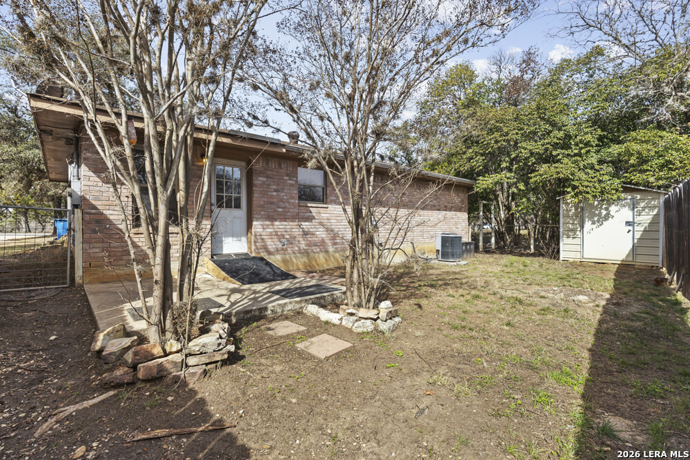 292 Montague Drive Bandera, TX 78003 - Photo 19 of 24 a view of a yard with a tree