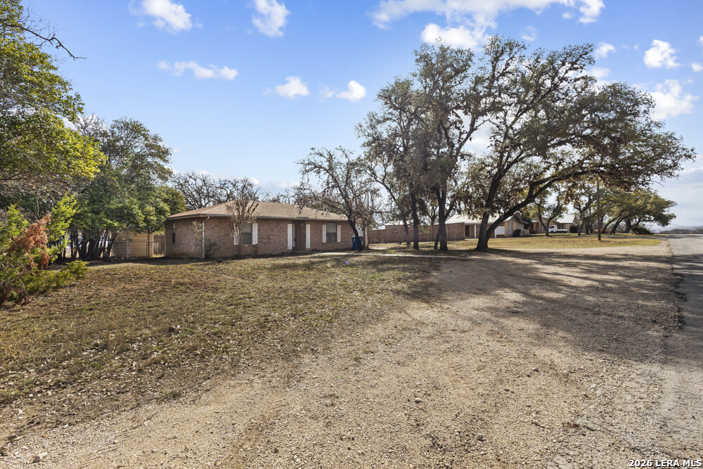 292 Montague Drive Bandera, TX 78003 - Photo 2 of 24 a front view of a house with a yard