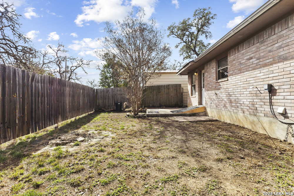 292 Montague Drive Bandera, TX 78003 - Photo 24 of 24 a view of a backyard with a tree