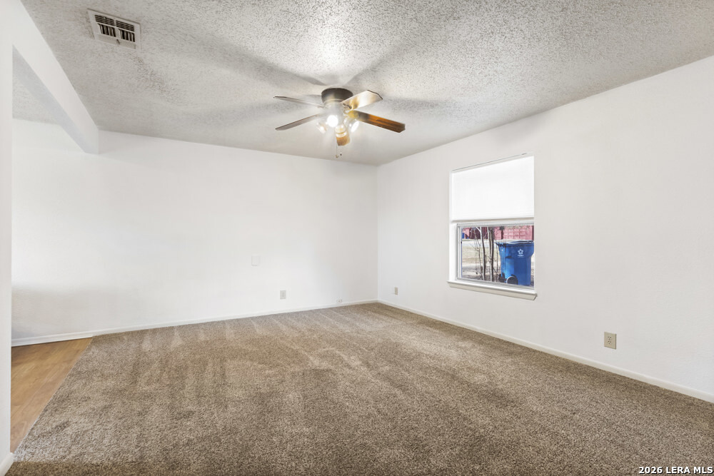 292 Montague Drive Bandera, TX 78003 - Photo 7 of 24 an empty room with windows and fan