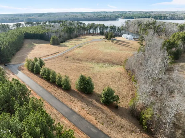 a view of lake with a yard