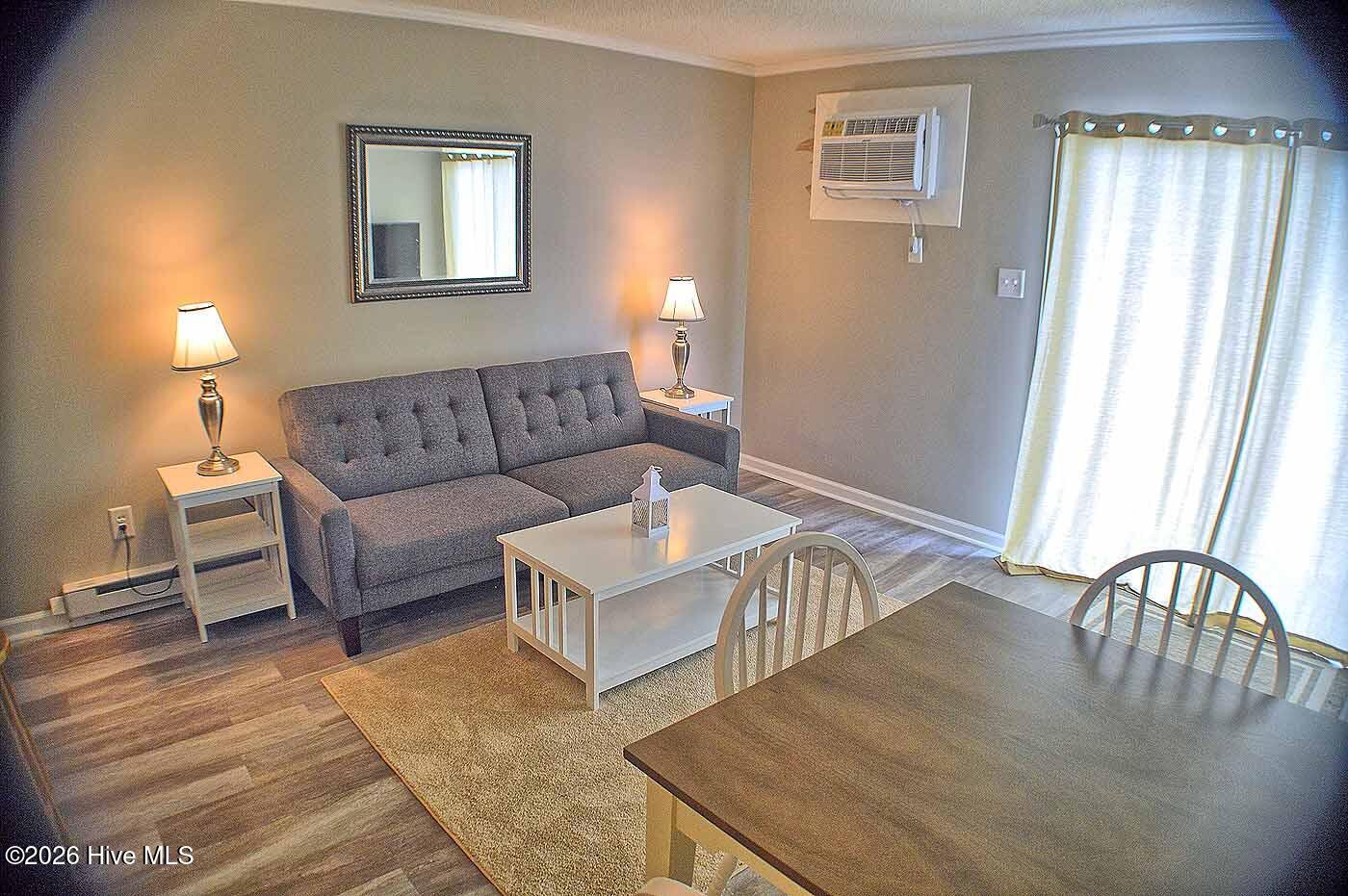 2250 New River Inlet Road, Unit 117 North Topsail Beach, NC 28460 - Photo 5 of 16 Living Room with Balcony Access