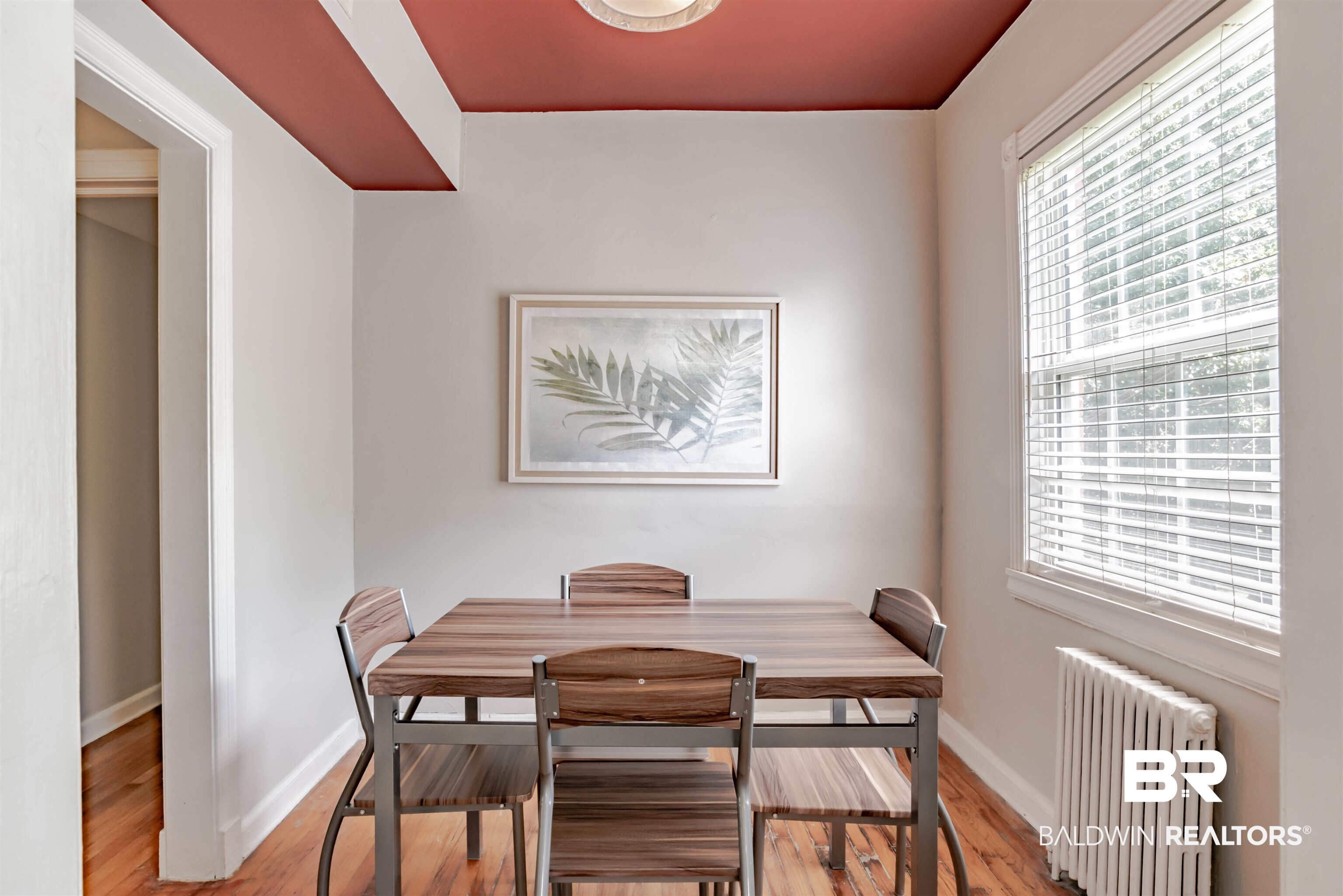 214 Upham Street, Unit 7C Mobile, AL 36607 - Photo 3 of 32 Dining area with radiator and light wood-style floors