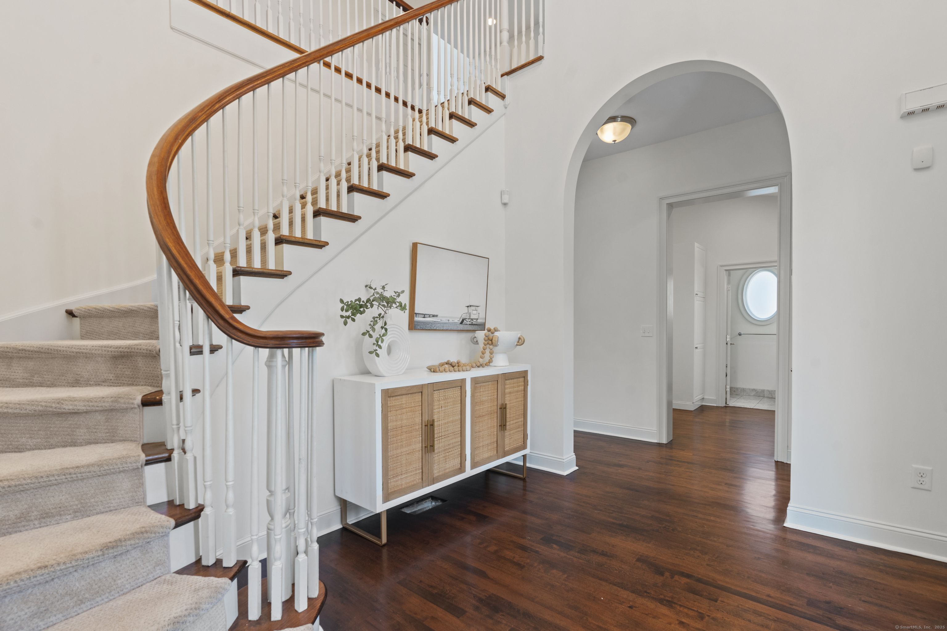 64 Webster Point Road Madison, CT 06443 - Photo 8 of 36 a view of an entryway with wooden floor and staircase