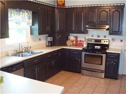 3050 Nicole Road Clarksville, TN 37040 - Photo 4 of 20 Huge country kitchen with tile floors, plenty of cabinets and newer stainless steel appliances.