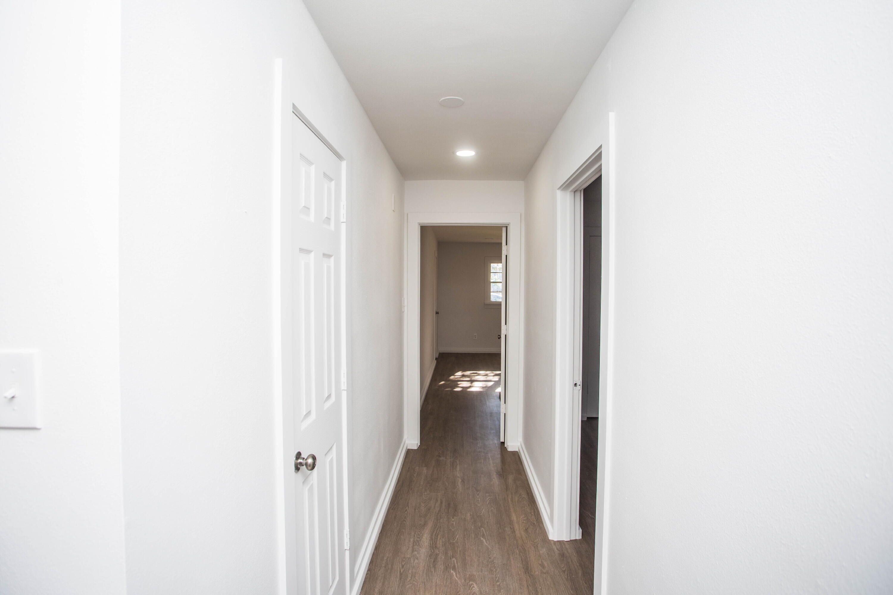 6004 Vernon Avenue Lubbock, TX 79412 - Photo 16 of 34 a view of a hallway with wooden floor