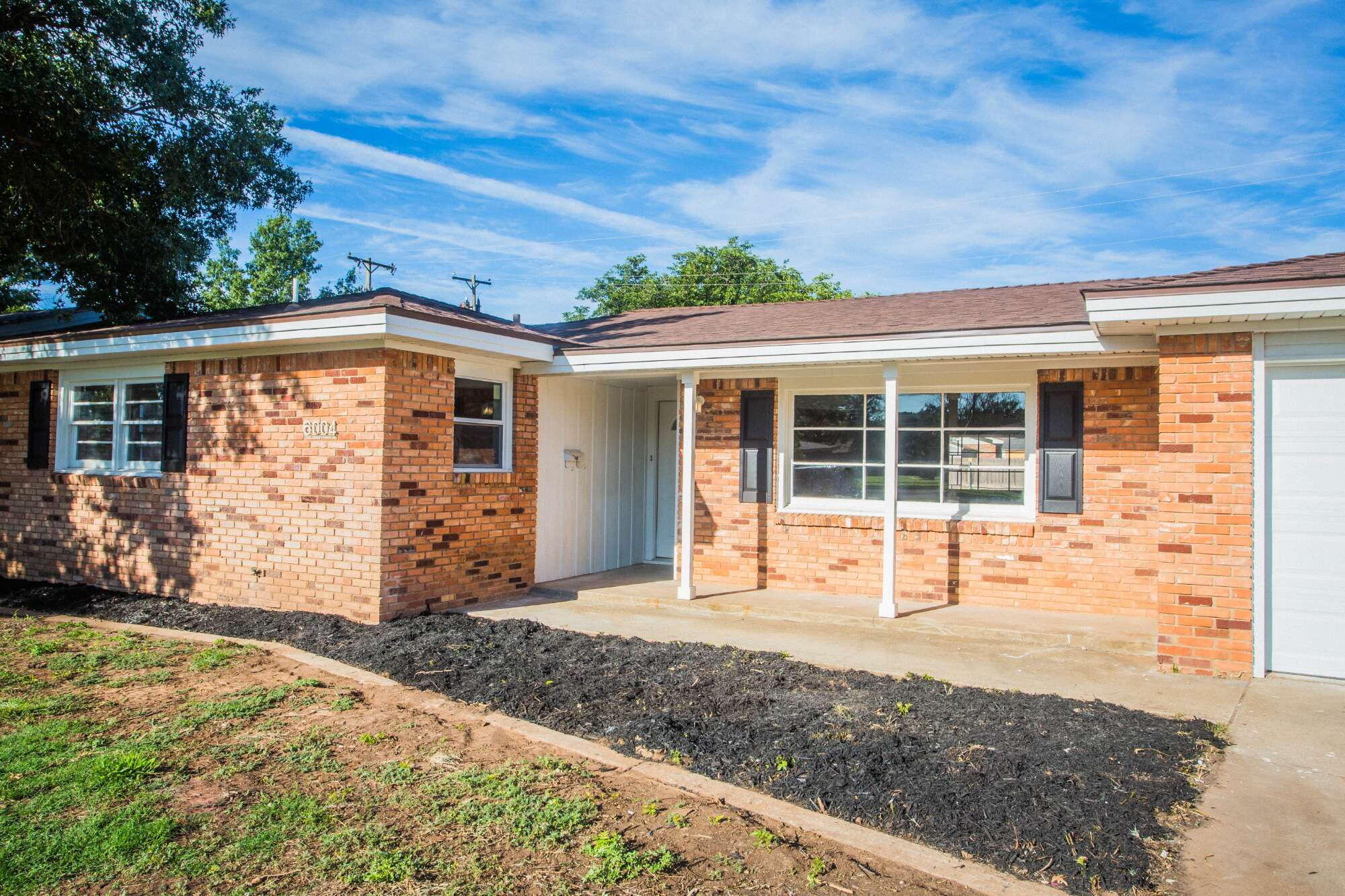 6004 Vernon Avenue Lubbock, TX 79412 - Photo 2 of 34 front view of a house with a yard