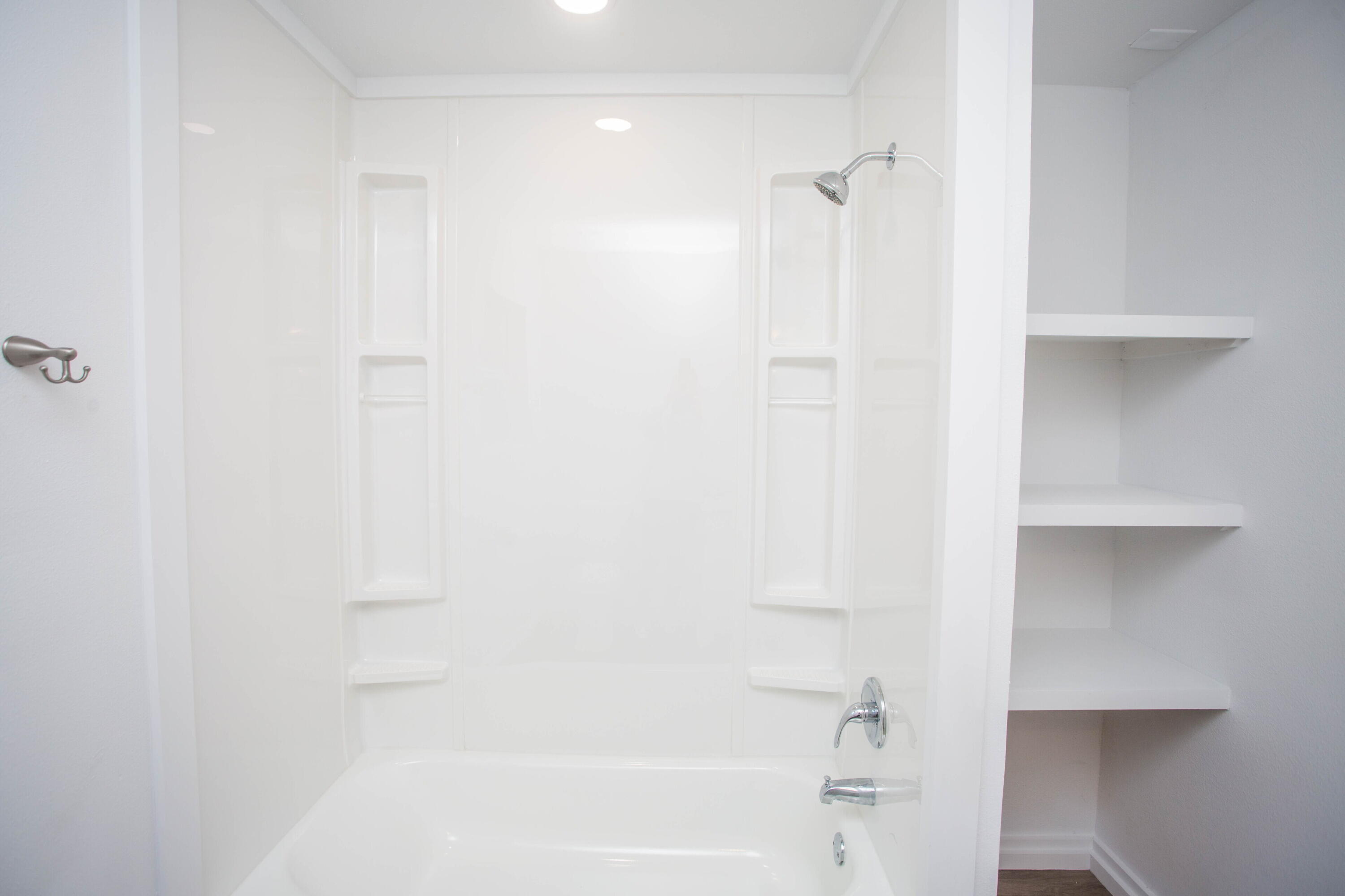 6004 Vernon Avenue Lubbock, TX 79412 - Photo 22 of 34 a bathroom with a bathtub