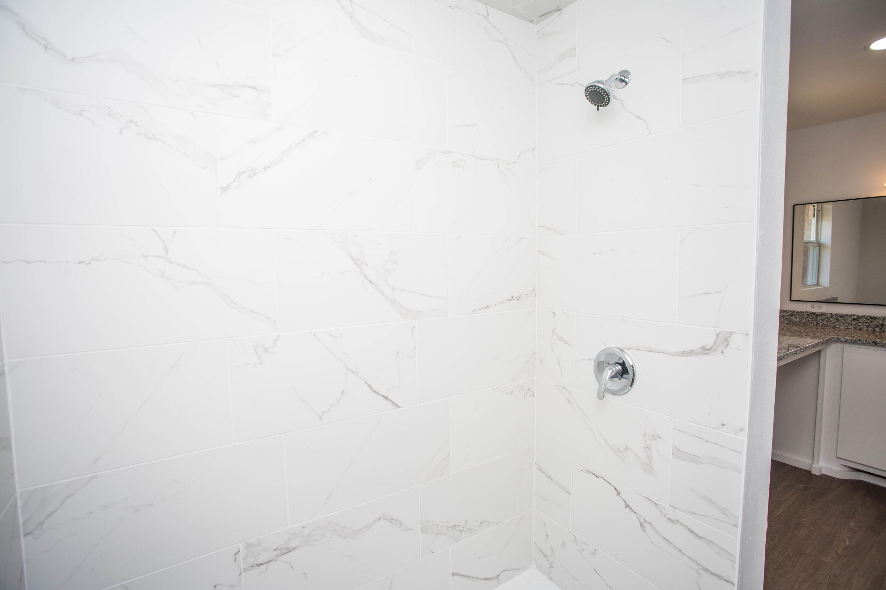 6004 Vernon Avenue Lubbock, TX 79412 - Photo 29 of 34 a bathroom with a shower