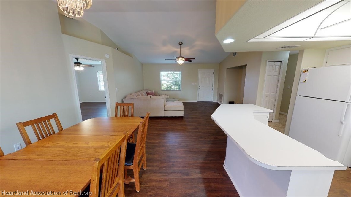 4243 Loquat Road Sebring, FL 33875 - Photo 6 of 25 a living room with furniture a flat screen tv and a large window