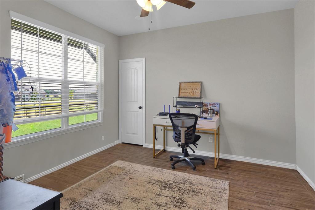154 Chester Road Springtown, TX 76082 - Photo 19 of 40 a view of a workspace with furniture and a window