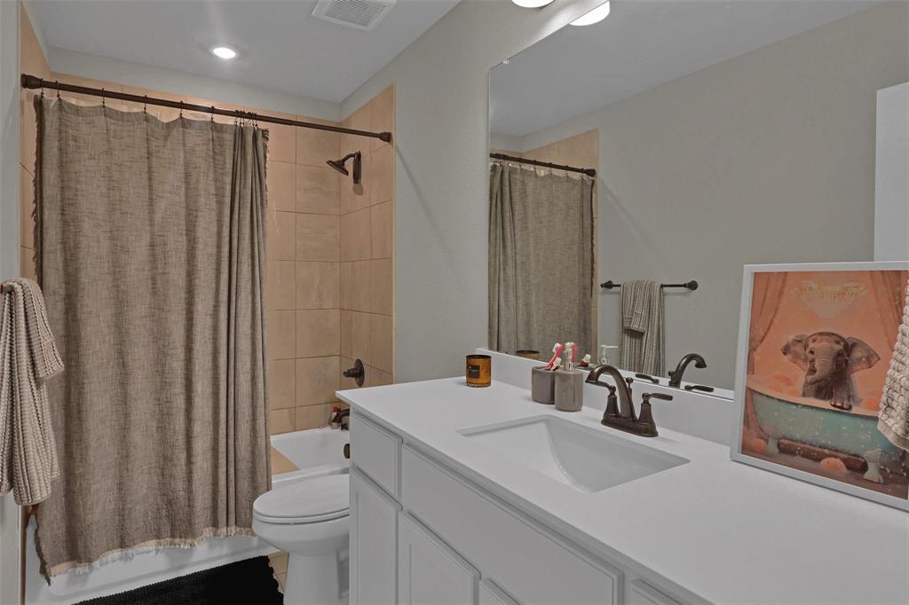 154 Chester Road Springtown, TX 76082 - Photo 31 of 40 a bathroom with a sink a toilet and shower