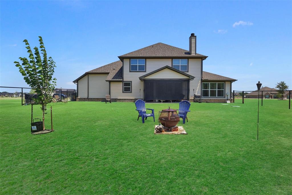 154 Chester Road Springtown, TX 76082 - Photo 34 of 40 a view of a house with a yard