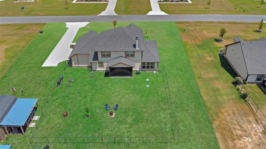 154 Chester Road Springtown, TX 76082 - Photo 35 of 40 a view of a house with a yard