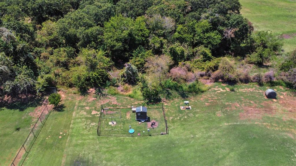 154 Chester Road Springtown, TX 76082 - Photo 36 of 40 an aerial view of residential houses with outdoor space and trees