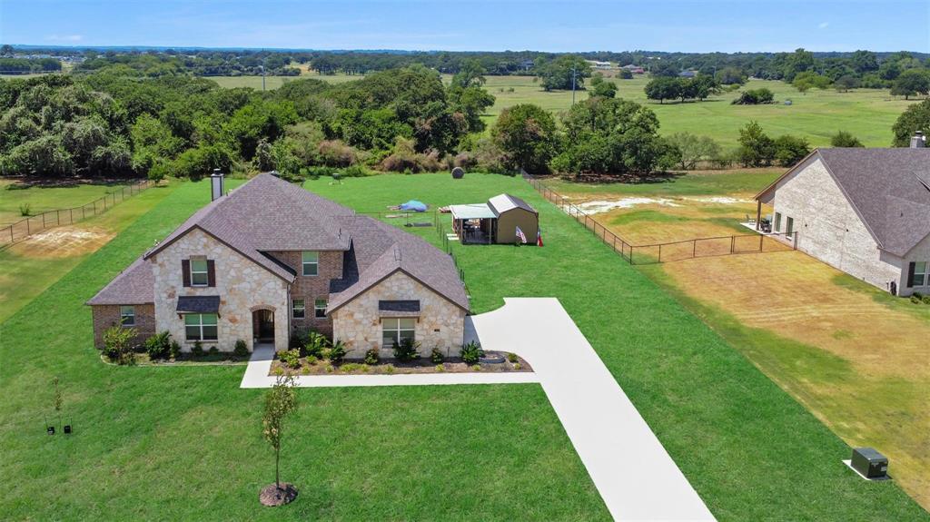 154 Chester Road Springtown, TX 76082 - Photo 38 of 40 a view of a house with pool and a yard