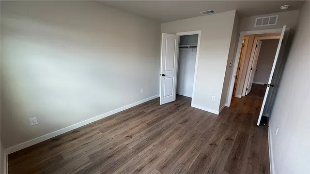 a bathroom with a double vanity sink a mirror and a bathtub