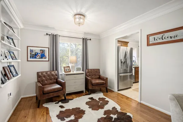 a living room with furniture and a rug