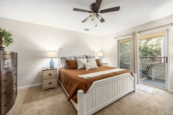 a bedroom with a bed and a tv