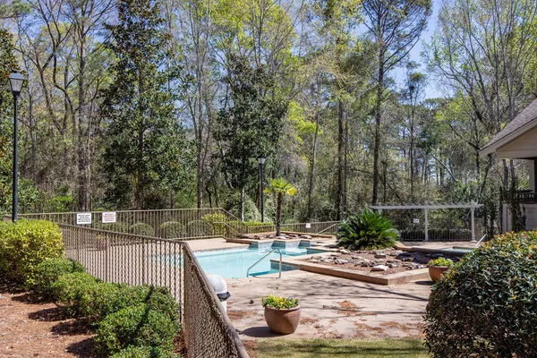 a view of a swimming pool with a patio
