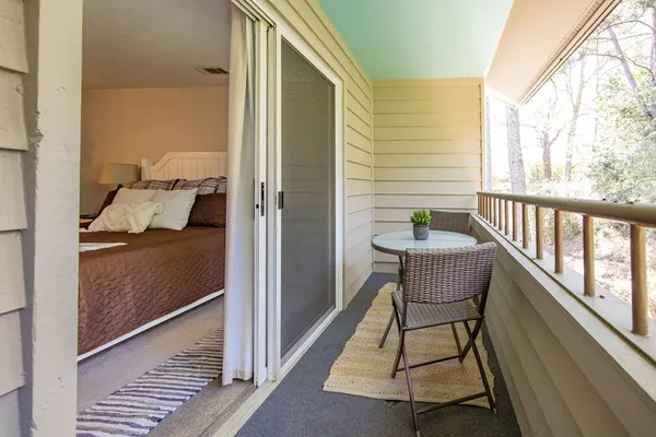 a balcony view with a outdoor seating