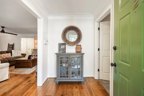 a view of living room with furniture and wooden floor