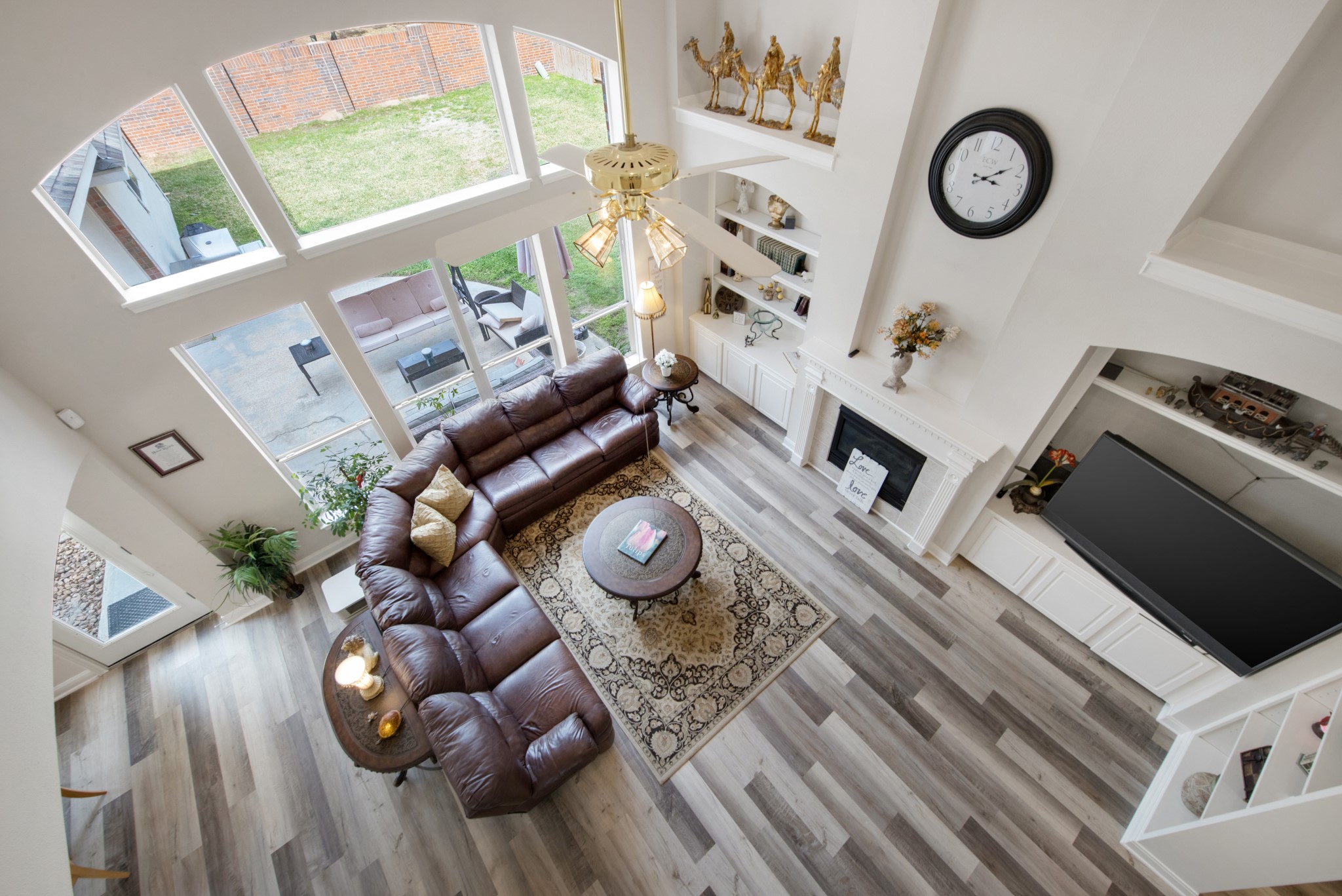 9510 Ashdown Forest Drive Spring, TX 77379 - Photo 16 of 50 LIVING ROOM – stunning overhead view showcasing the dramatic ceiling height and expansive windows. Natural light fills the room while the open layout highlights the home’s architectural design.