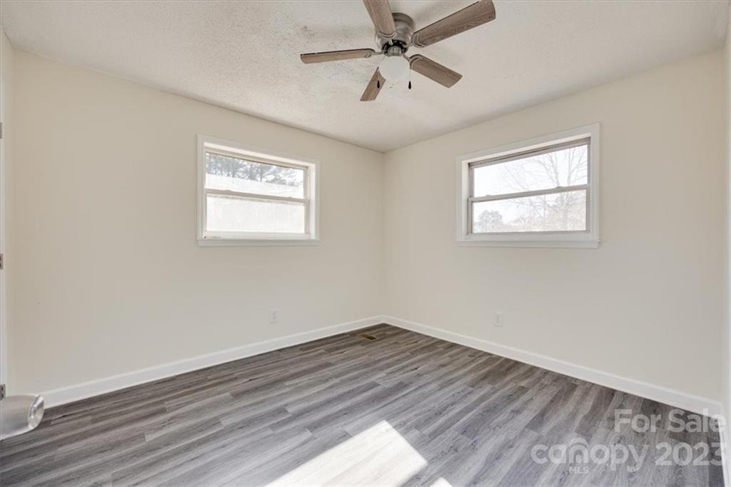 2887 State Rd S-29-330 Lancaster, SC 29720 - Photo 15 of 28 a view of empty room with wooden floor