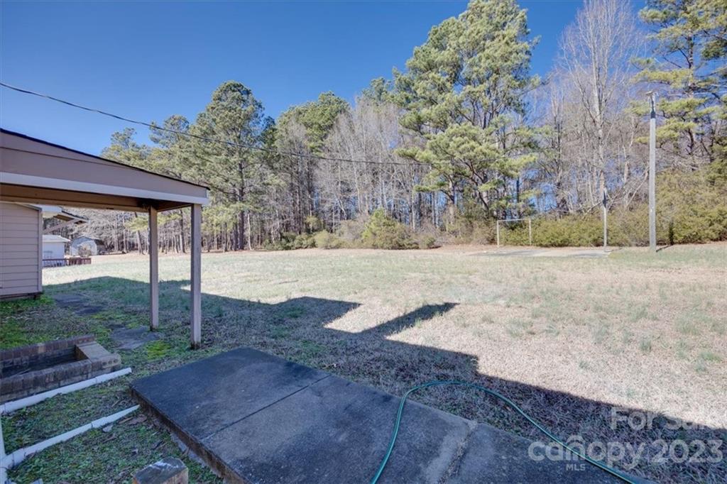 2887 State Rd S-29-330 Lancaster, SC 29720 - Photo 20 of 28 a view of a backyard with large trees