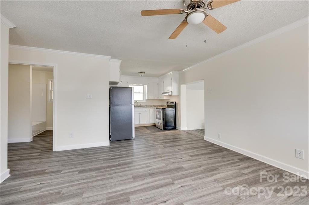 2887 State Rd S-29-330 Lancaster, SC 29720 - Photo 5 of 28 a view of empty room with wooden floor and ceiling fan