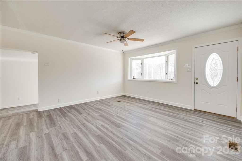2887 State Rd S-29-330 Lancaster, SC 29720 - Photo 8 of 28 wooden floor in an empty room with a window