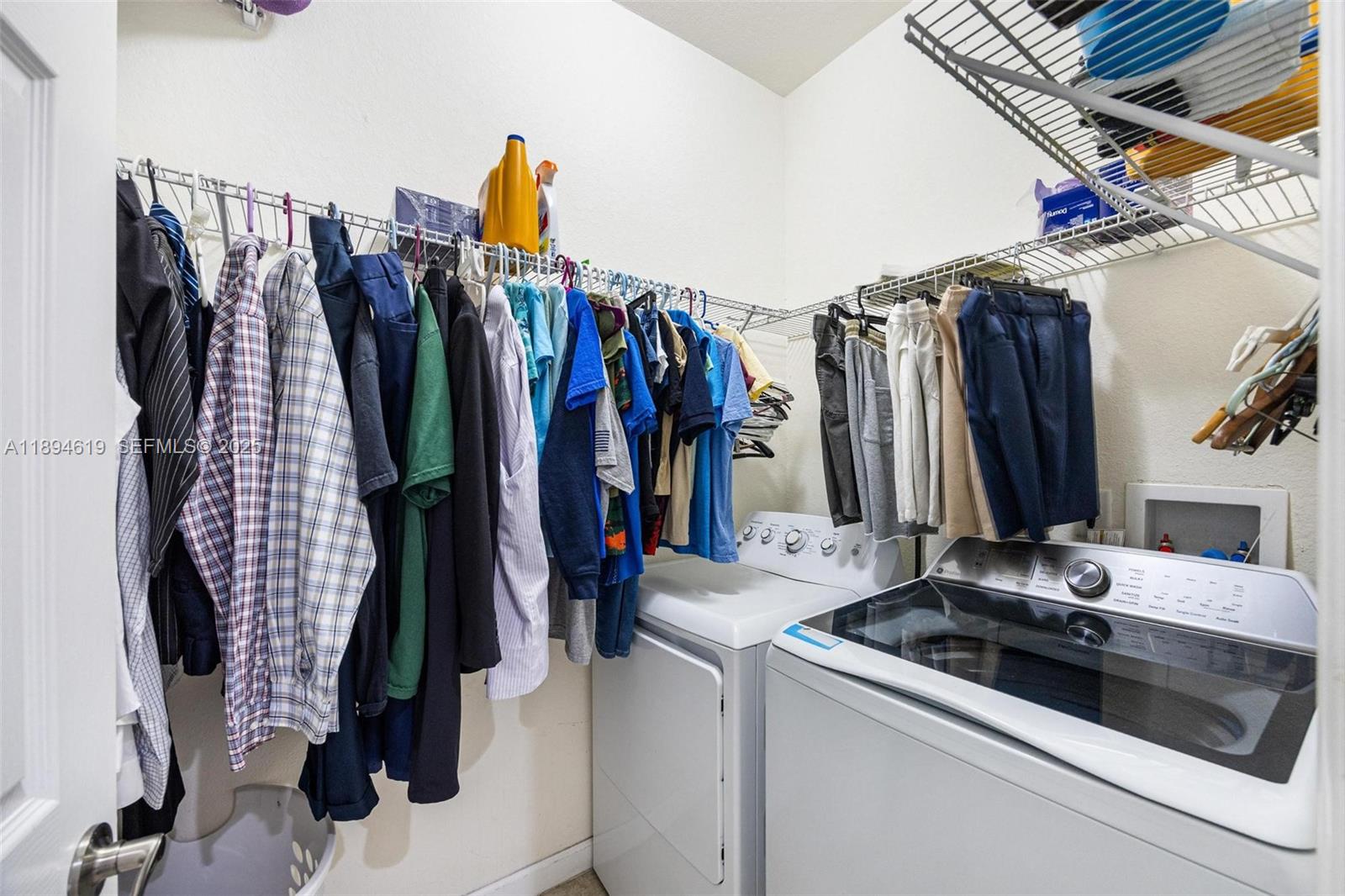 415 Southeast 34th Terrace Homestead, FL 33033 - Photo 24 of 60 a view of walk in closet with clothes and shoes