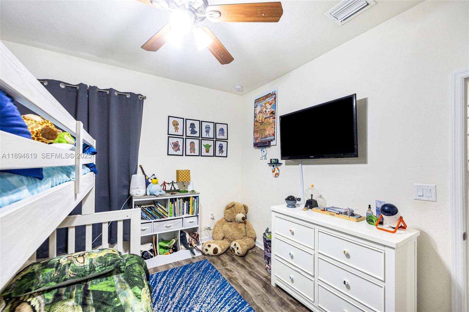 415 Southeast 34th Terrace Homestead, FL 33033 - Photo 31 of 60 a bedroom with furniture and a flat screen tv