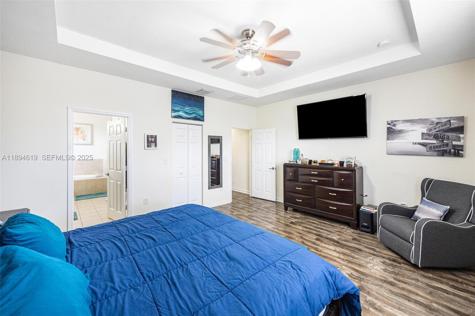 415 Southeast 34th Terrace Homestead, FL 33033 - Photo 34 of 60 a spacious bedroom with a bed and a flat screen television